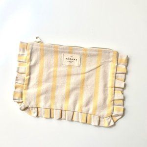 Sezane yellow striped clutch